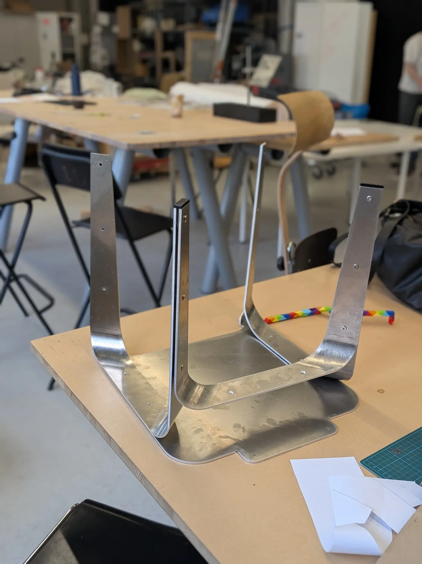 The bent 4 mm parts standing on cardboard, part-way through assembly.