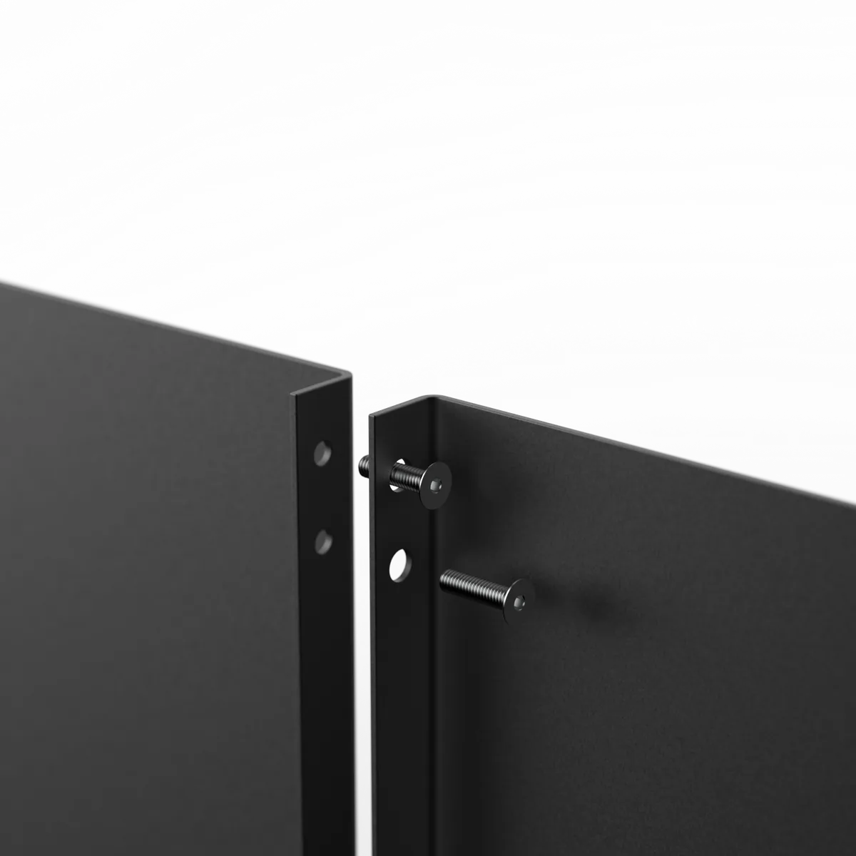 Close-up of the screw joint that replaces a welded seam between two panels.
